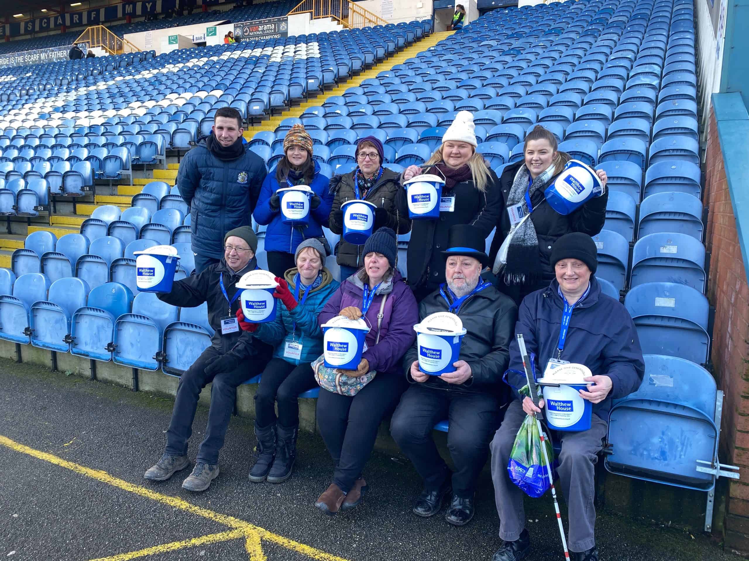 Bucket collectors at football ground