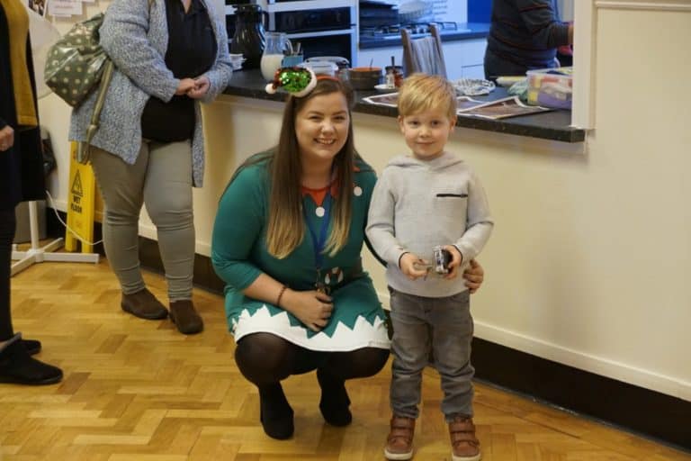 Woman and child at Christmas fair.