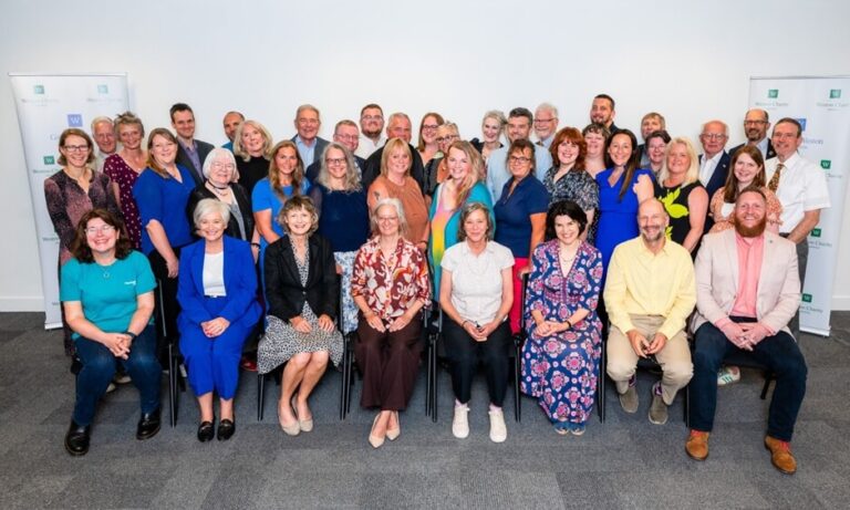 Large group of people posing for a photo.