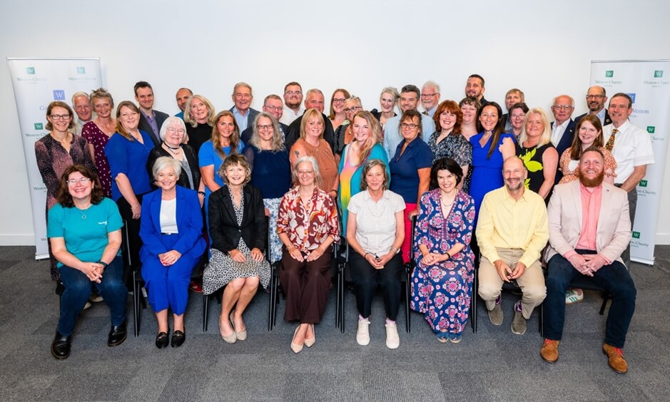 Large group of people posing for a photo.