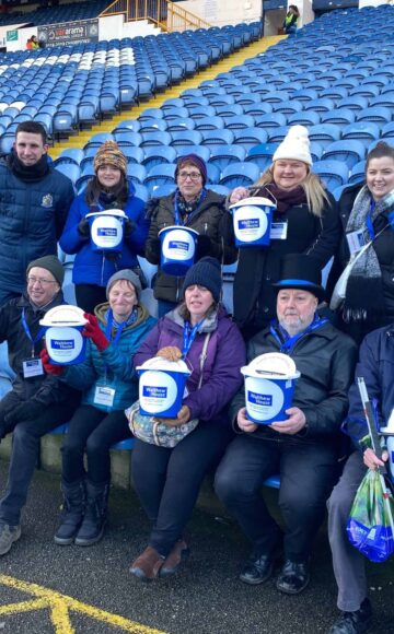 Bucket collectors at football ground