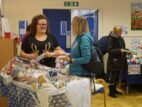 6 Volunteer Caroline selling raffle tickets at the fair