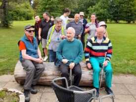 Pitch and putt Group of people sat at a golf course.