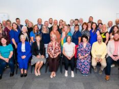 Large group of people posing for a photo. Large group of people posing for a photo.