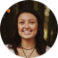 Smiling woman with dark hair wearing a necklace Smiling woman with dark hair wearing a necklace