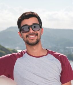 Smiling young man volunteering outdoors